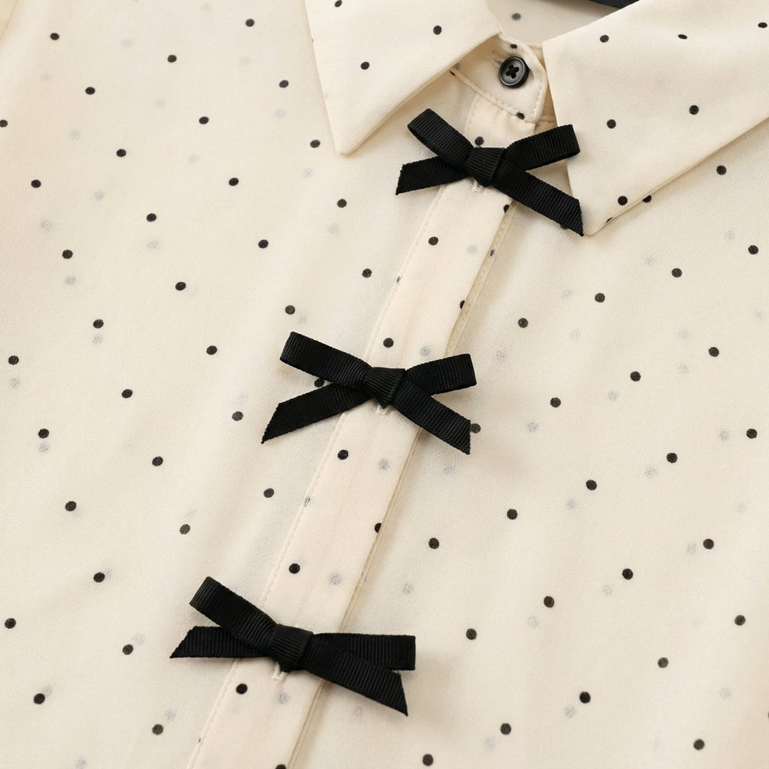 Blusa a pois con fiocco al collo