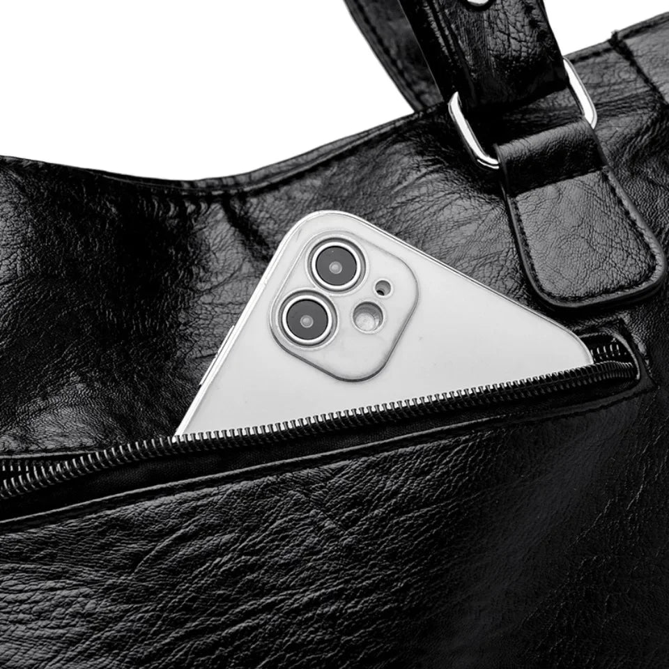 Borsa a tracolla liscia con forma spaziosa