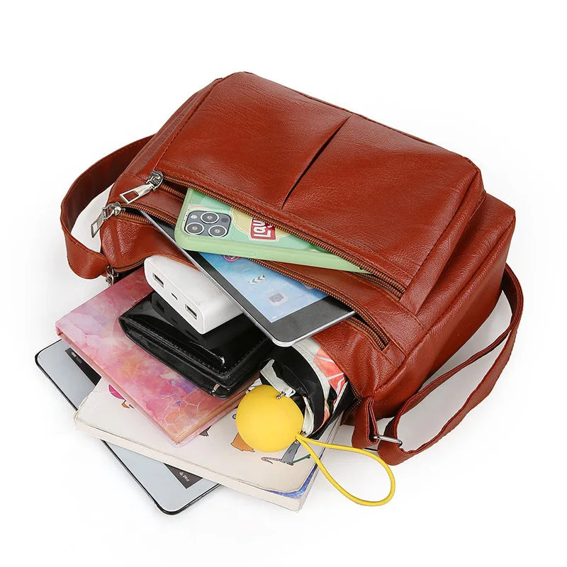 Borsa a tracolla liscia con più tasche