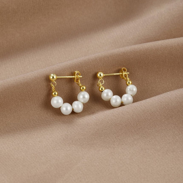 Orecchini circolari Celine con delicato dettaglio