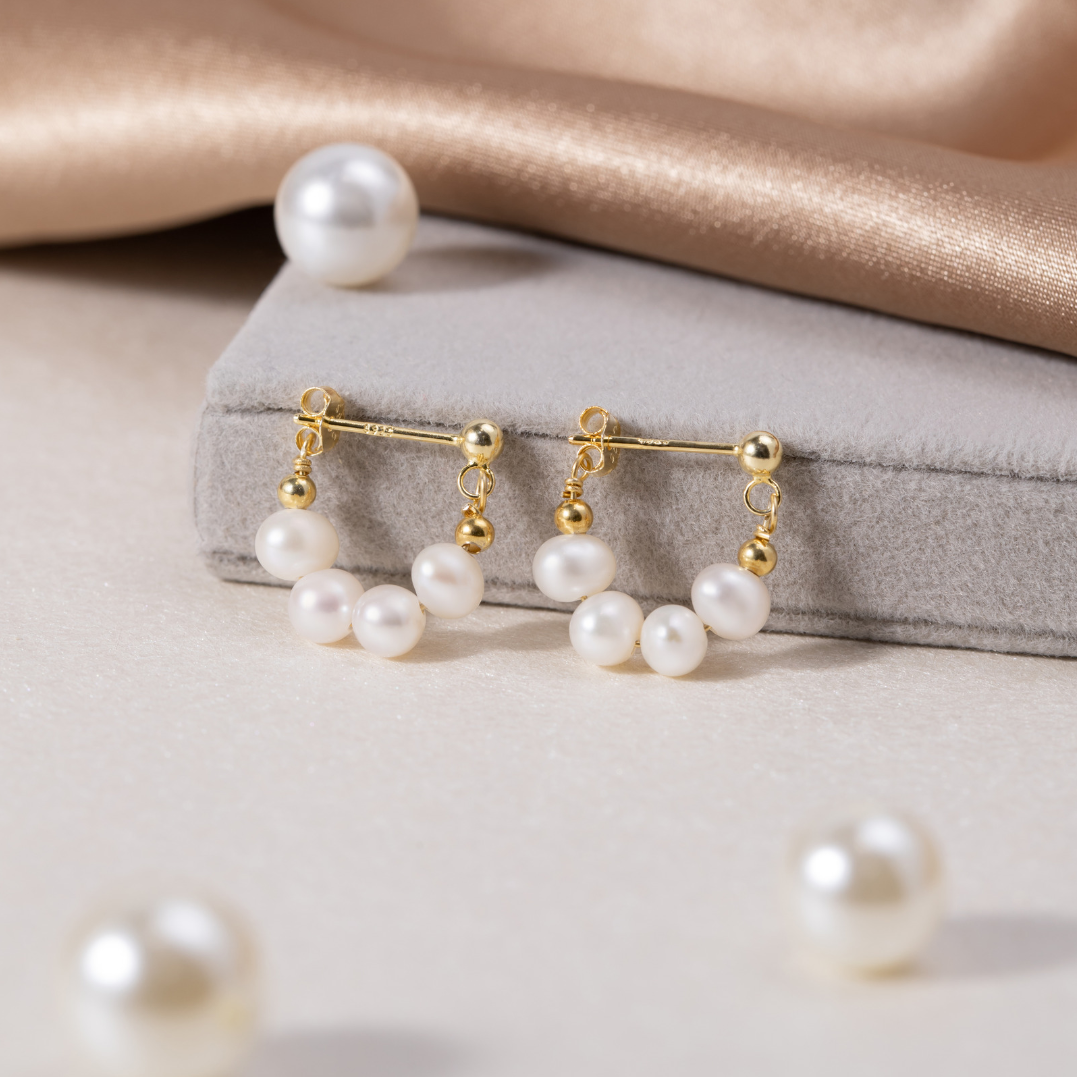 Orecchini circolari Celine con delicato dettaglio