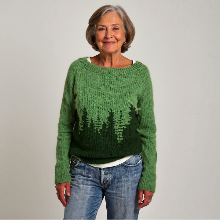 Maglione verde intrecciato con silhouette di foresta sull&