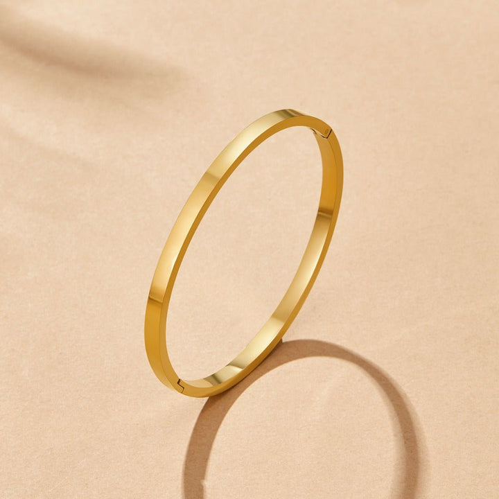 Bracciale rigido dorato Rina
