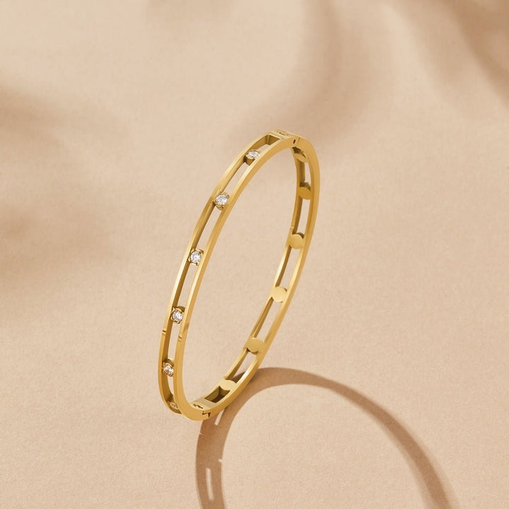 Bracciale rigido dorato Sofia con dettagli lucidi